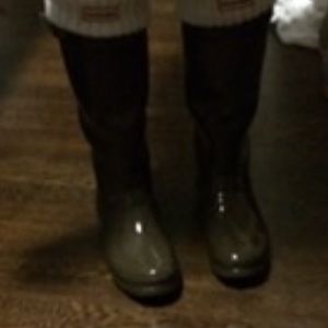 Woman’s tall hunter rain boots
